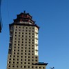 Because of the requirement, that each building in Astana has to be unique, many buildings are influenced by the architectures from other parts of the world. The roof of the building on the photo resembles e.g. the roof of a Far Eastern pagoda.