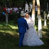 Bridal couple in Navoi Park. They are Kyrgyz people identifiable by man`s hat: traditional Kyrgyz felt kalpak.