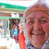 A bazaar saleswoman with golden teeth.