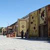Selling beautiful carpets on the street in Bukhara.