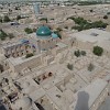 View from the lookout platform at the top of Islam Khoja minaret over the old city from Khiva. The building with the oval turquoise dome with white ornaments on the lower edges is the Pahlawan Mahmud Mausoleum.