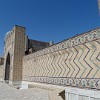 The high, decorated outer walls surround the whole Bibi-Khanym Mosque.