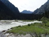 The Karakol river pours out widely in the scenic Karakol Valley. The whole valley is protected as a national park and probably for this reason it looks much more pristine than the valleys used as pasture ground. It was particularly much densely forested.