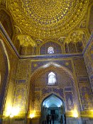 The Tilya-Kori Madrasah means in Persian "Gilded". Together with 2 other madrasahs (Islamic schools) it frames a public square called Registan in heart of the ancient city of Samarkand. On this square people gathered to hear royal proclamations, heralded by blasts on enormous copper pipes. It was a place of public executions too.