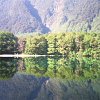 The Mirror Lake along the way to Milford Sound in Fiordland is a very scenic place with a lake that is so clear, the reflection is like looking into a mirror.